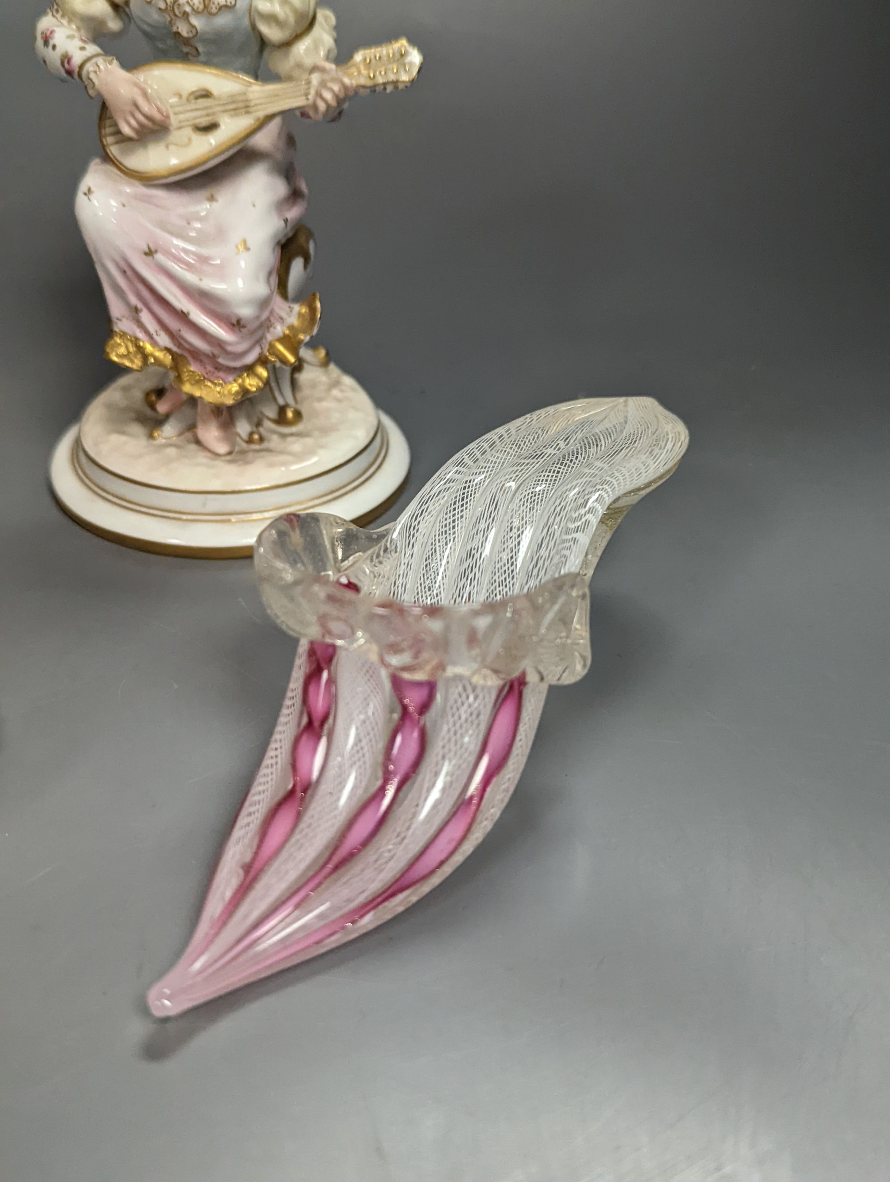 A pair of Royal Crown Derby figures of musicians, c.1905, 15cm, two similar animal paperweights and a Latticino glass slipper, tallest being the dragon 11cm